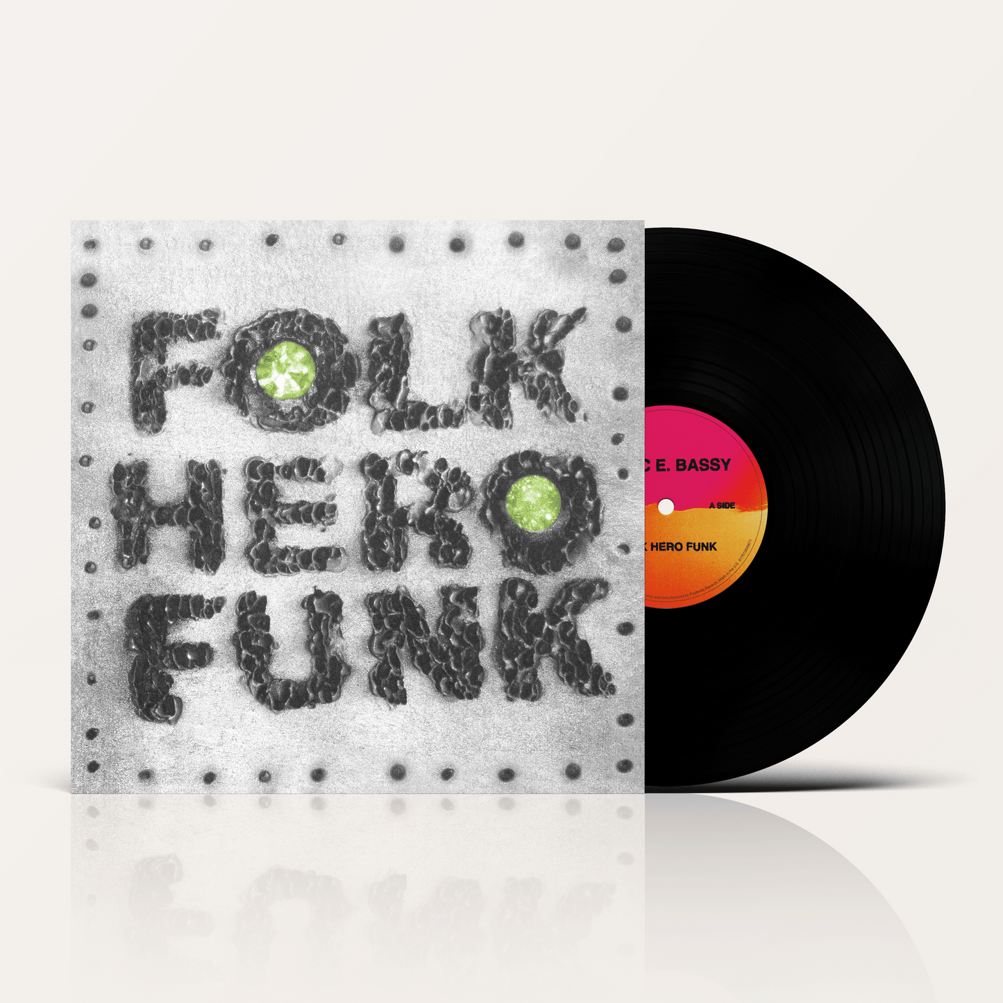 Marc E Bassy's album Folk Hero Funk vinyl record and album artwork